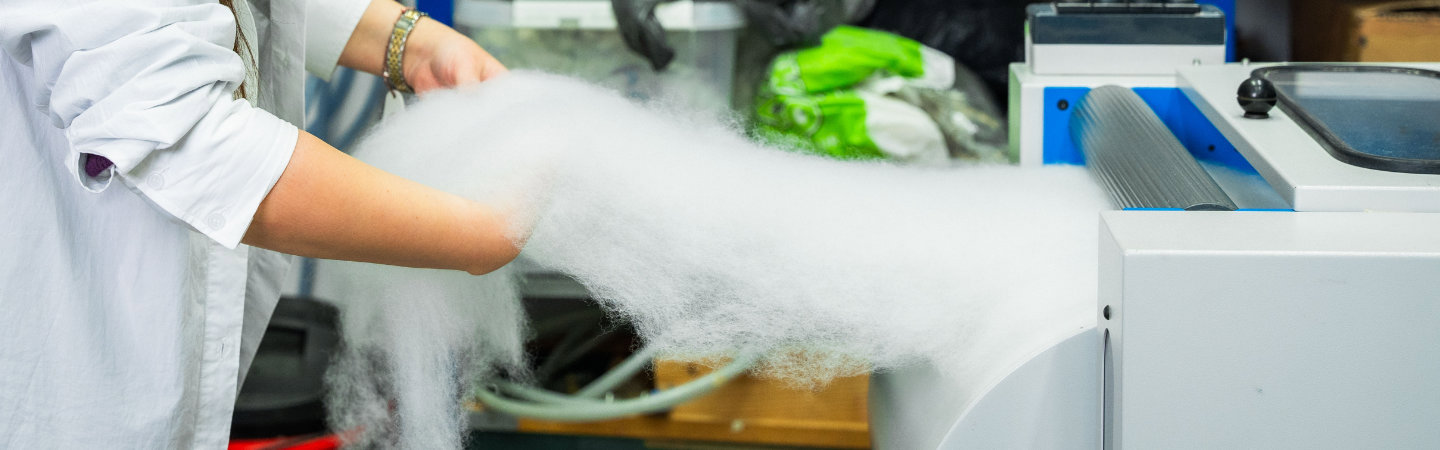 hands handling textile materials